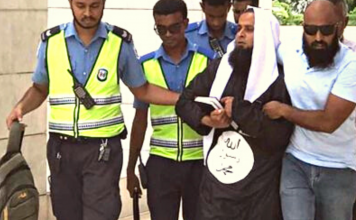 Unidentified man bearing ISIS logo in his clothes gets arrested